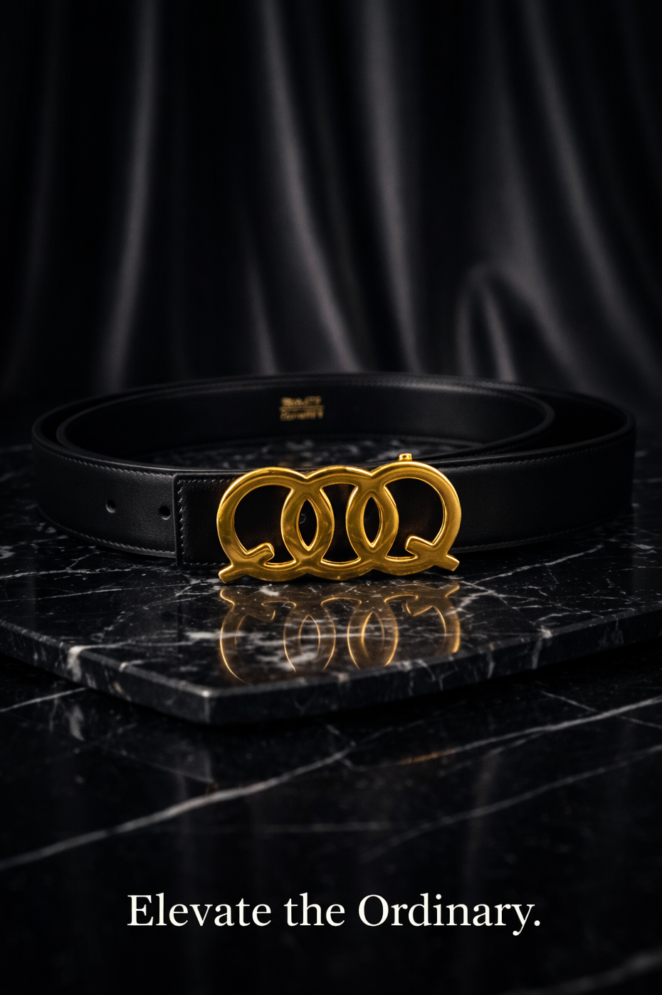 Black belt with gold buckle on a dark marble surface, featuring the QOQ brand.